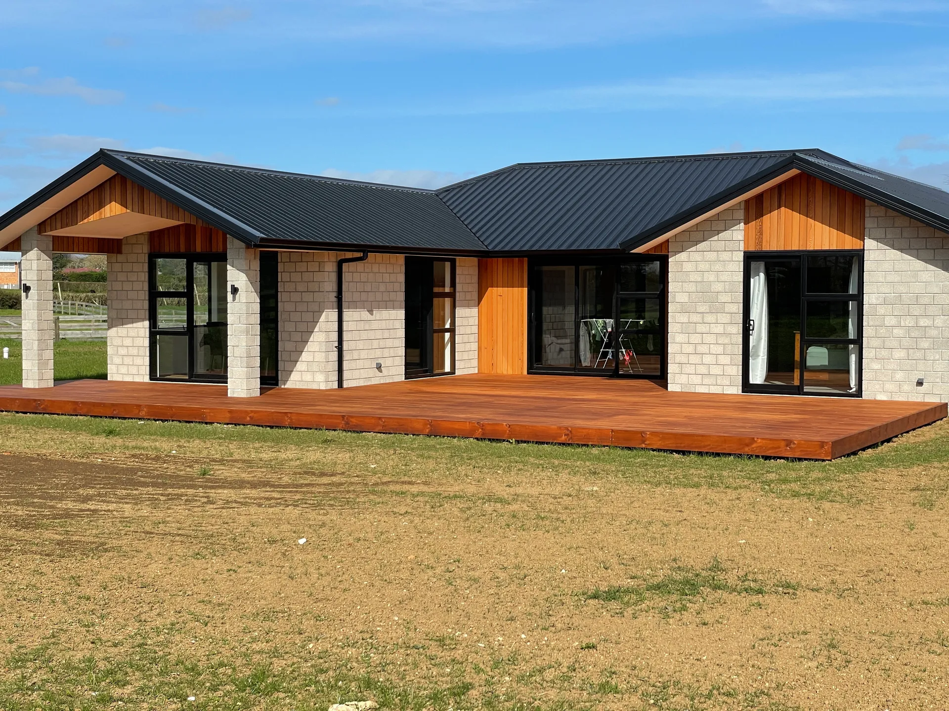 Completed block and cedar home with timber deck