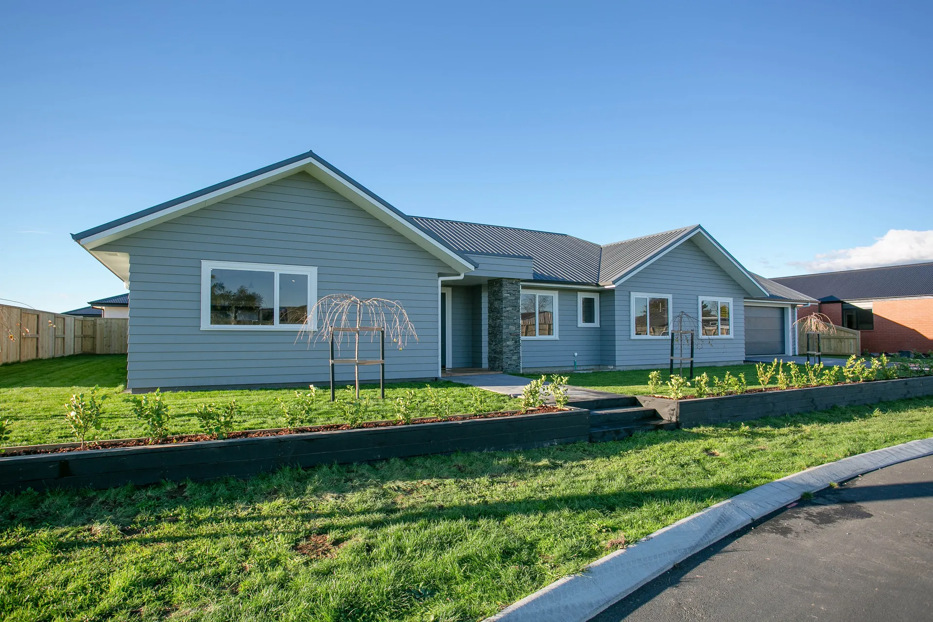 Front elevation with weatherboard and stone