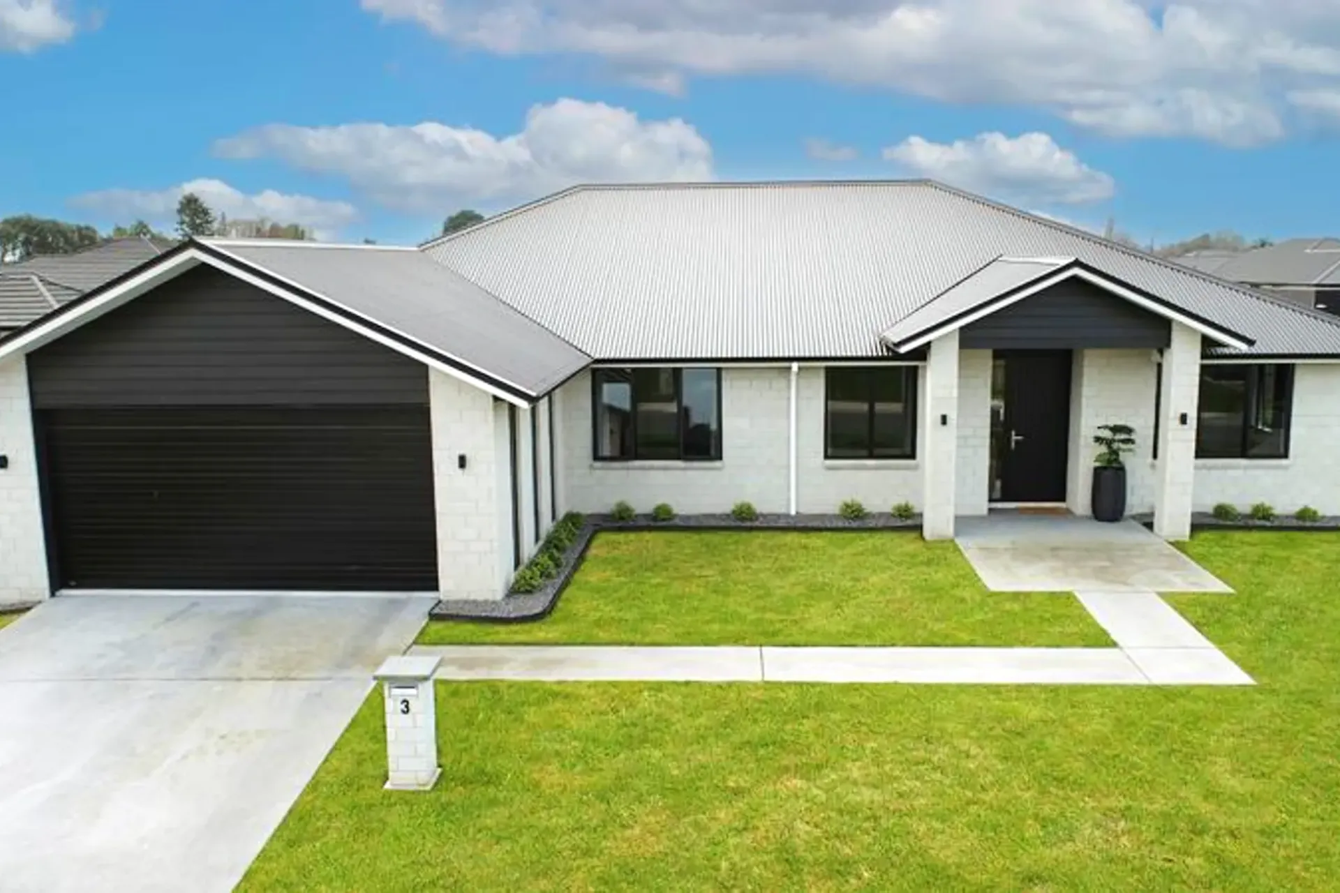 Front street view with double garage and landscaping