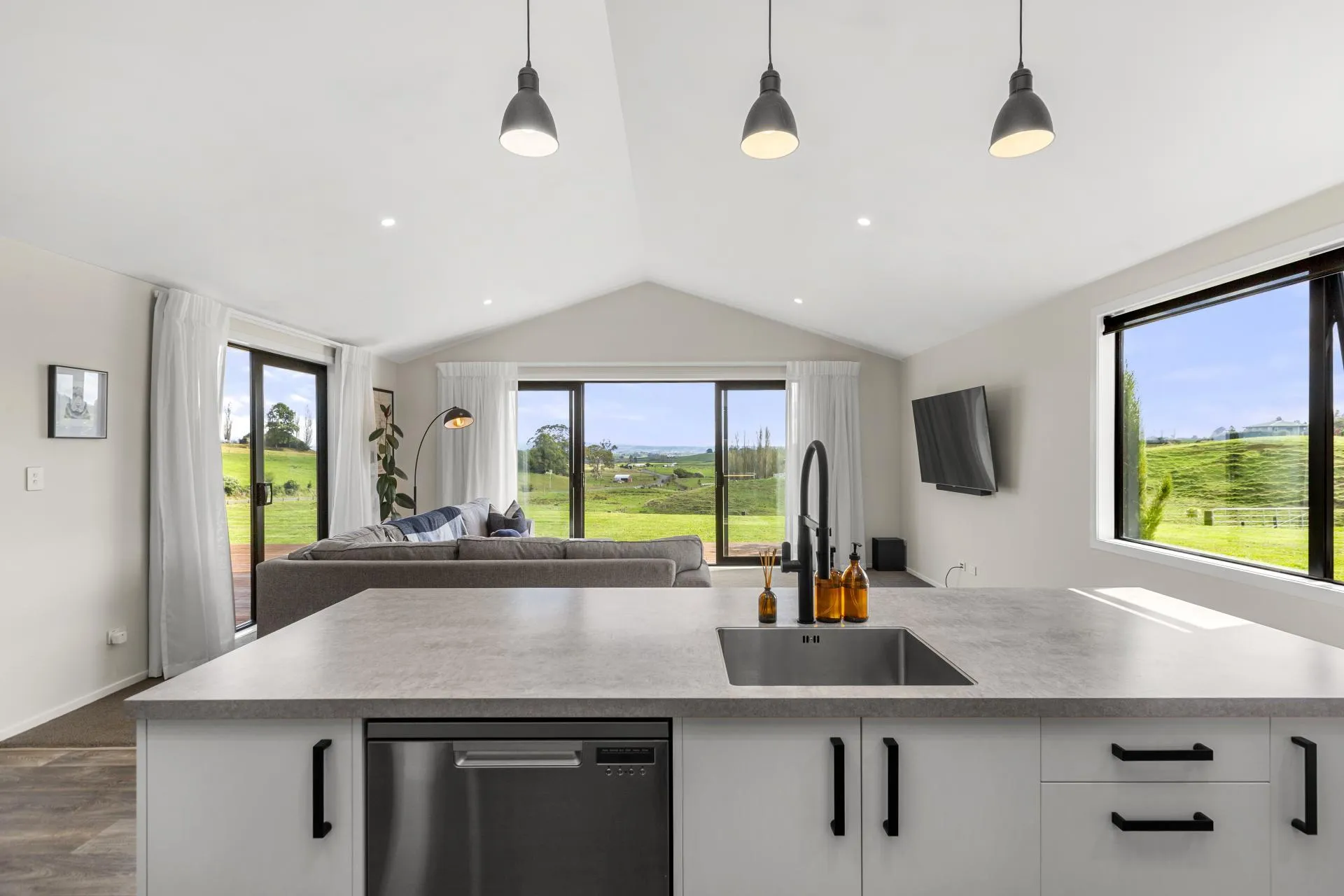 Open-plan kitchen and living with rural views