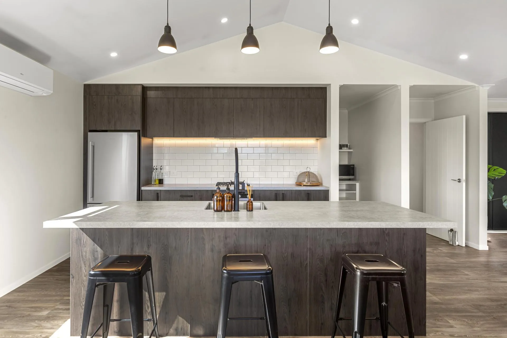 Kitchen with stone island and pendant lights