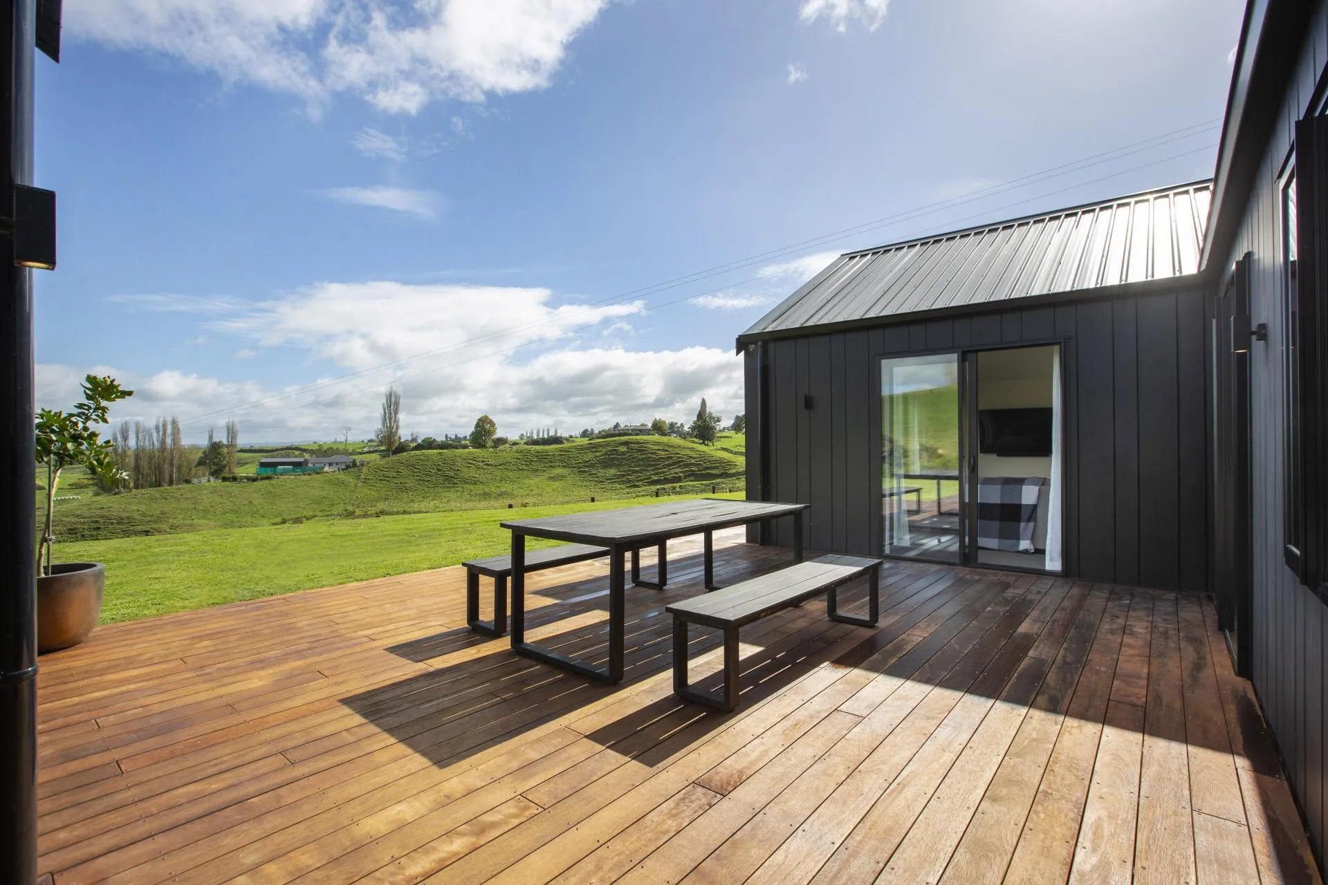 Timber deck with outdoor dining and rural outlook
