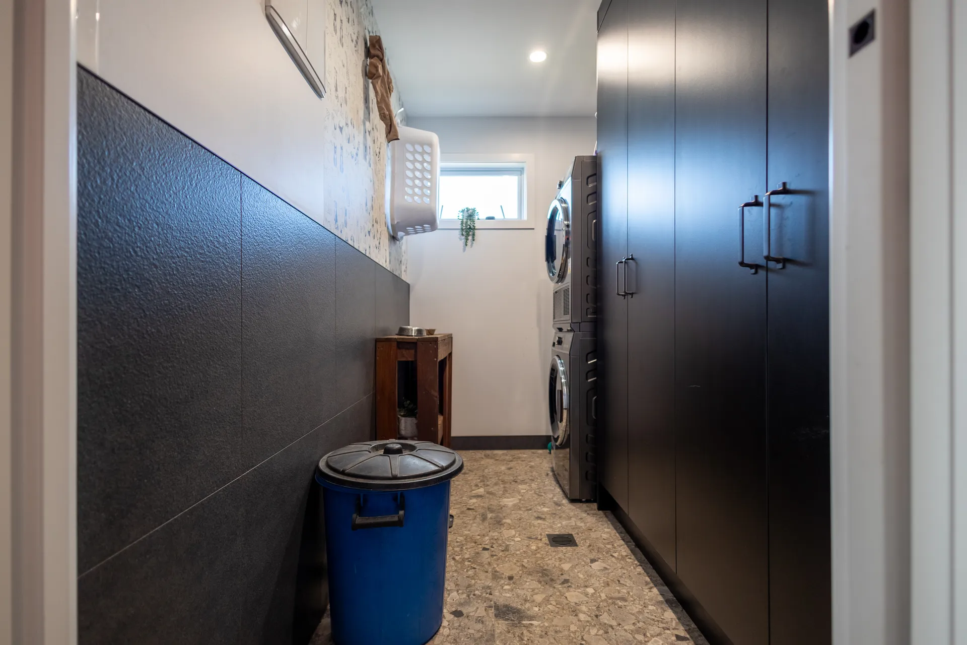 Matching dark laundry with custom cabinetry